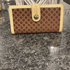 Vintage Celine Macadam pattern long wallet in brown and tan leather.